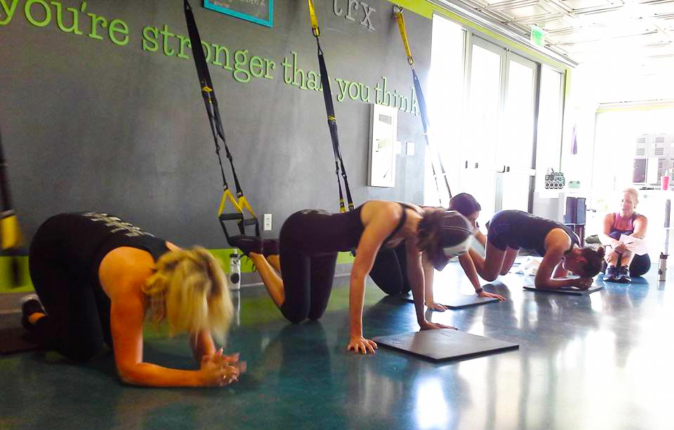 Some of the ladies about to test their TRX knee tuck strength