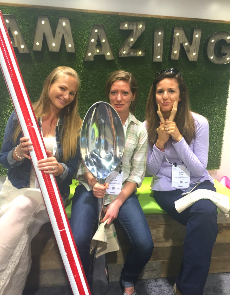 Me, Julia, and Sarah posing at the Amazing Grass booth with some rather large props 