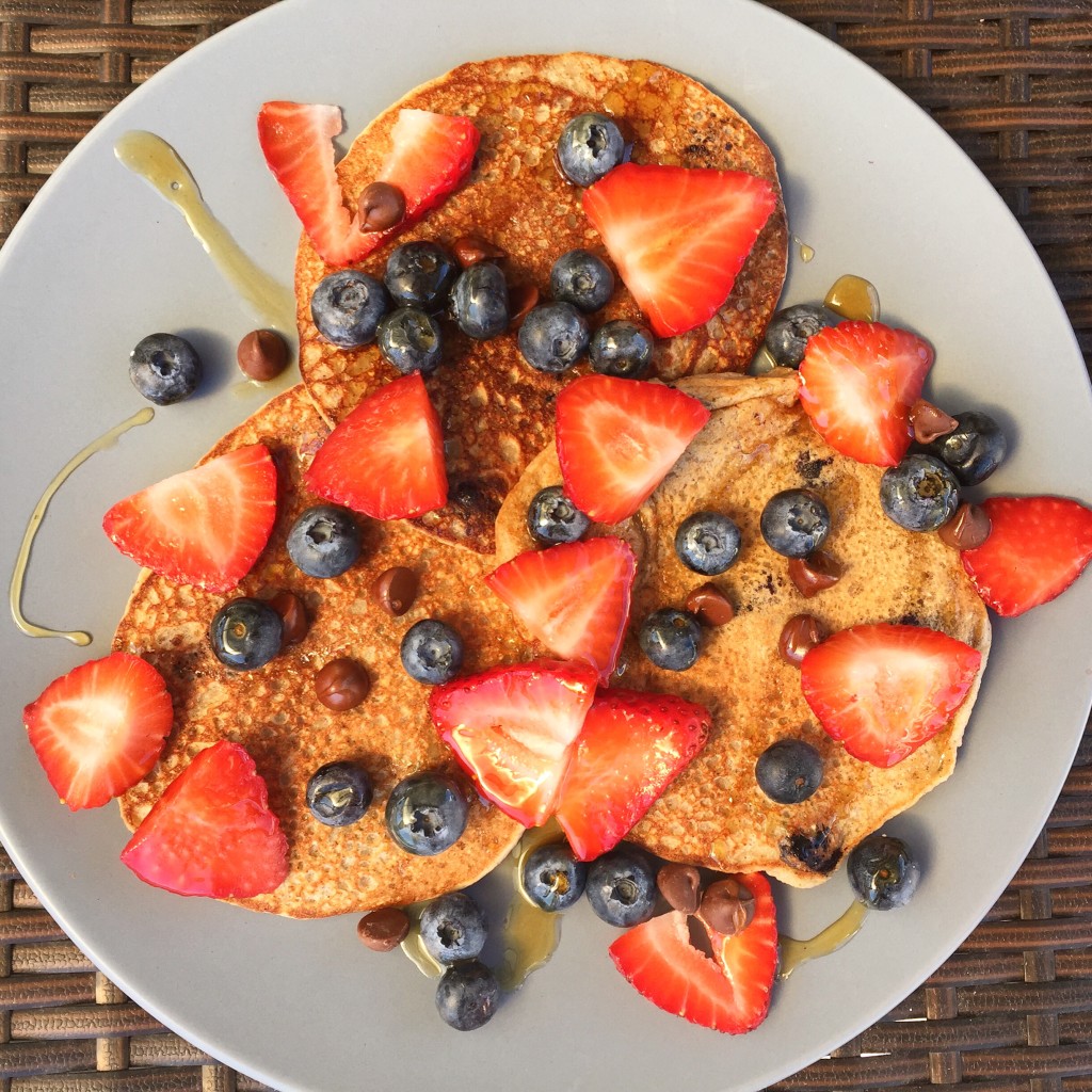 Banana protein pancakes topped with lots of fruity, chocolatey goodness! 